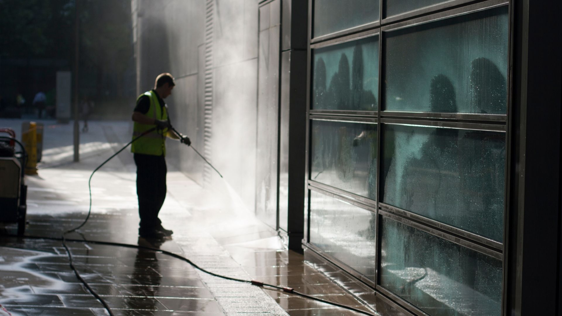 professional pressiional pressure washing walkway of commercial property